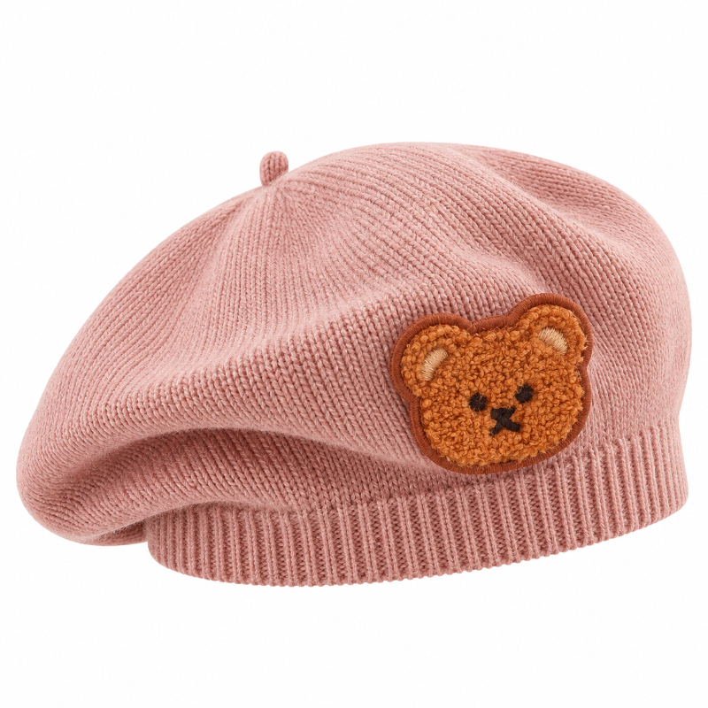 Béret bébé en maille rose avec écusson ourson